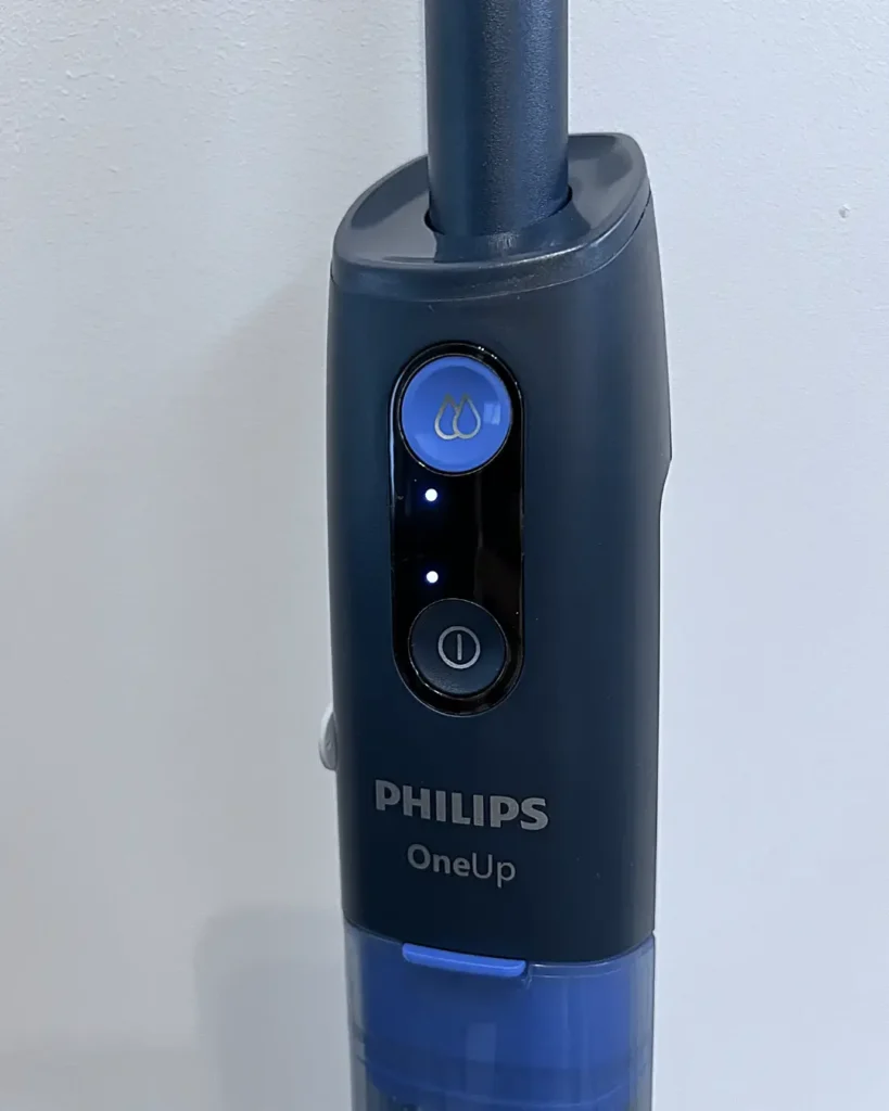 Przycisk stopnia nawilżenia na mopie Philips