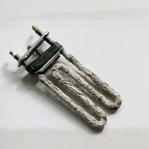 kamień z wody na elementach pralki