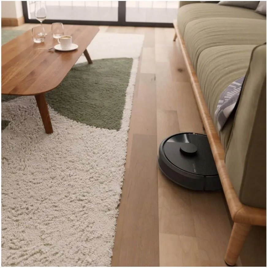 iRobot Roomba 105 Combo AutoEmpty wystajacy spod kanapy