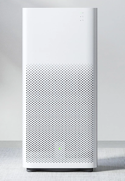 Oczyszczacz powietrza Xiaomi Air Purifier 2H na szarym tle, widok od przodu.